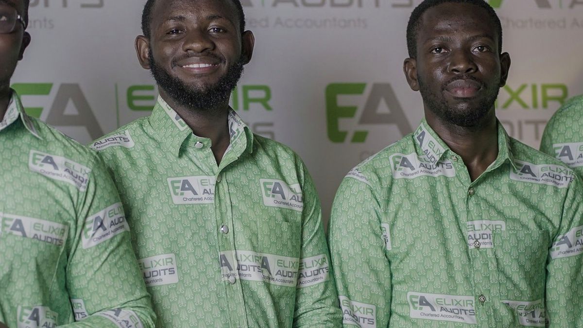 Elixir Audits colleagues in matching printed shirts at the firm's annual awards night